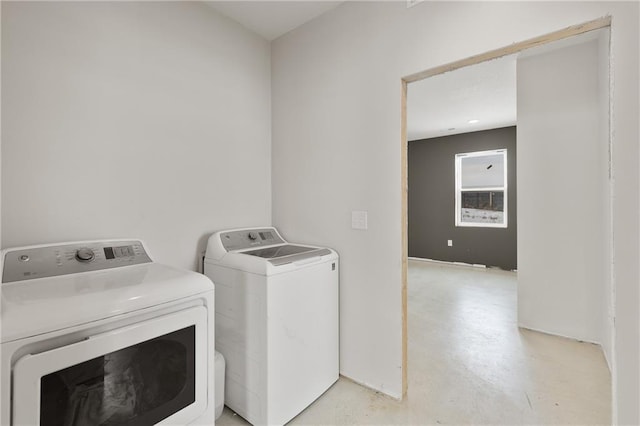 laundry room with washing machine and clothes dryer