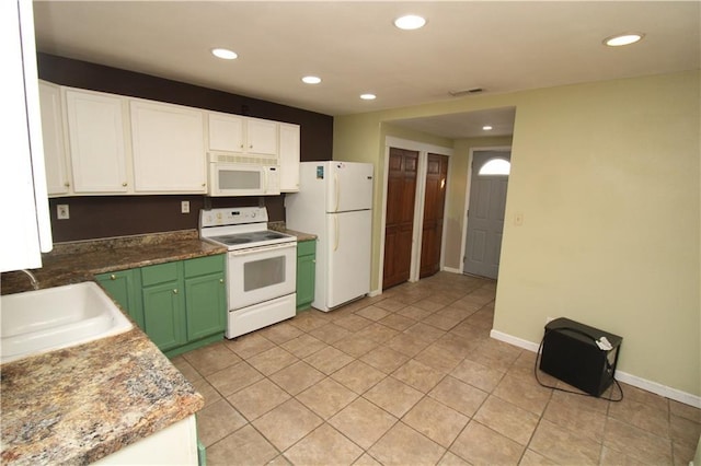 kitchen with recessed lighting, white appliances, a sink, visible vents, and white cabinetry