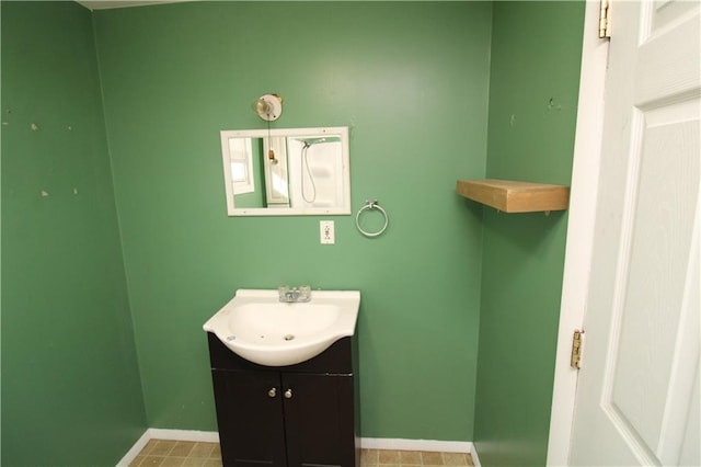 bathroom with baseboards and vanity