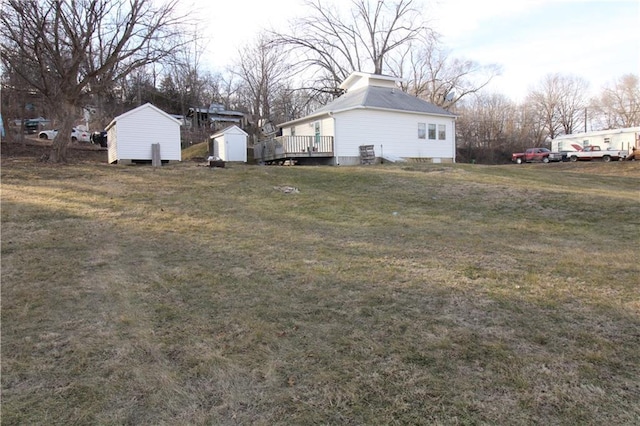 view of yard with a storage shed and an outdoor structure