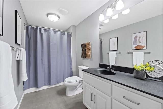 bathroom with vanity, curtained shower, and toilet