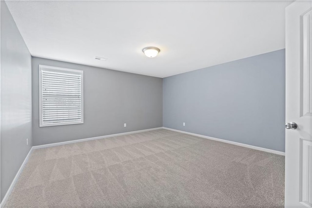 empty room featuring light carpet