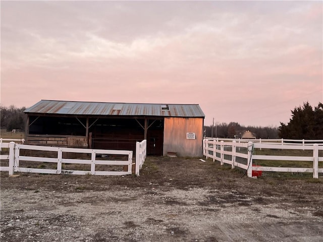 view of stable featuring a rural view