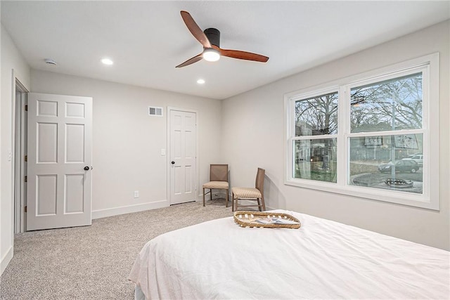 carpeted bedroom with ceiling fan