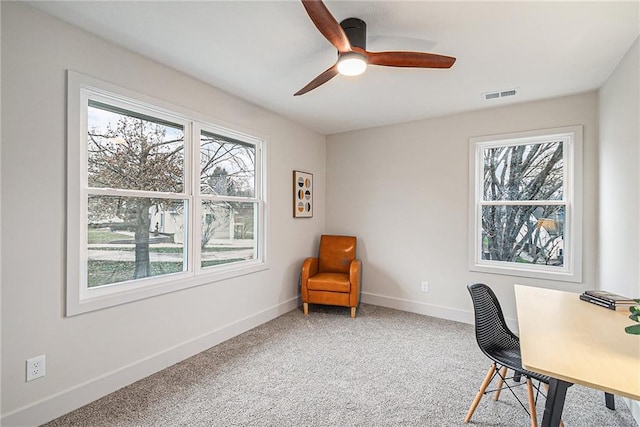 home office featuring carpet and ceiling fan