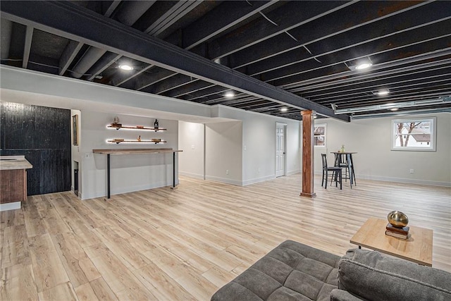 basement with hardwood / wood-style flooring