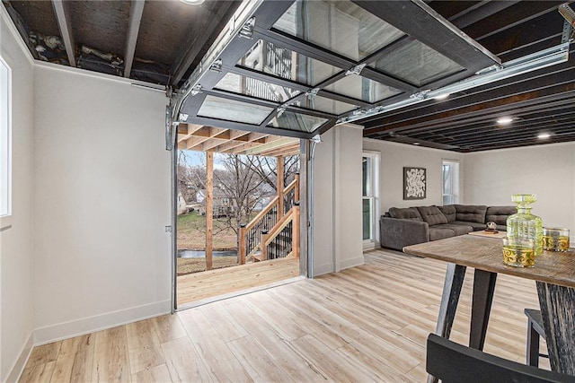 unfurnished living room with hardwood / wood-style floors and plenty of natural light