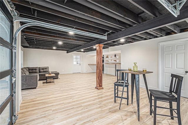 basement featuring light hardwood / wood-style floors