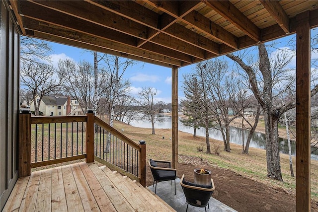 wooden deck featuring a water view