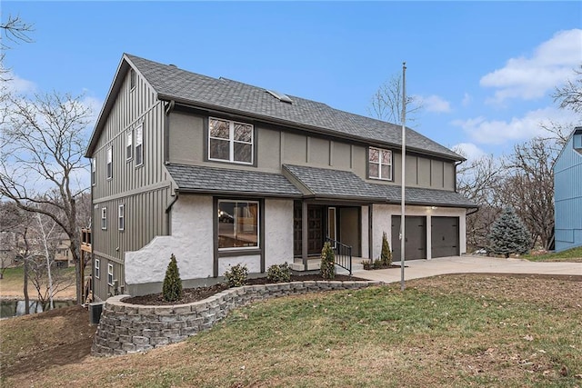 view of front of property featuring a garage, central air condition unit, and a front lawn