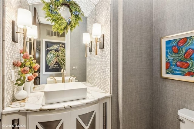 bathroom with vanity and toilet