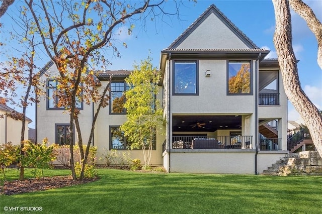 rear view of property featuring a yard