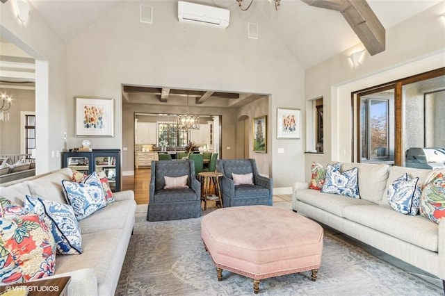 living room featuring a notable chandelier, beamed ceiling, high vaulted ceiling, and a wall mounted AC