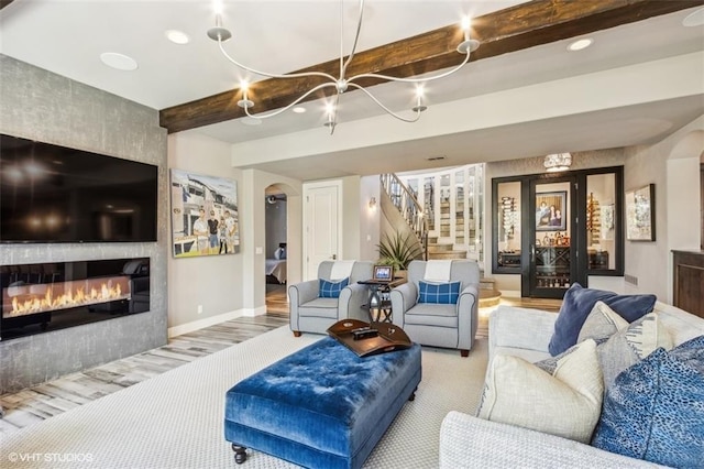 living room with a fireplace and beam ceiling