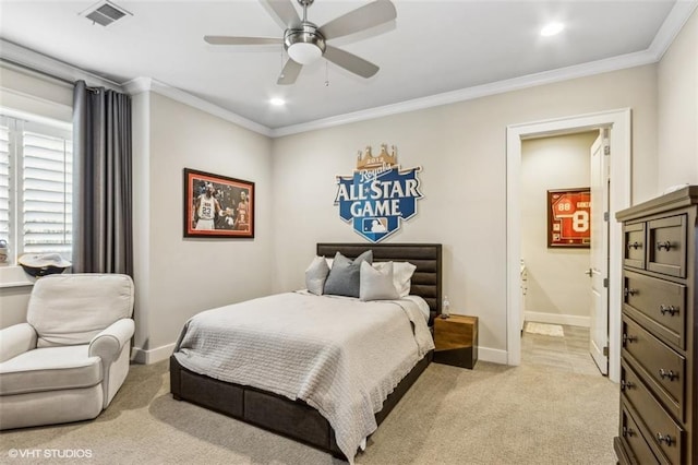 bedroom with crown molding, light colored carpet, ceiling fan, and ensuite bathroom