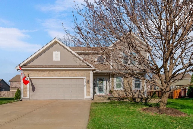 view of front of property featuring a front yard and a garage