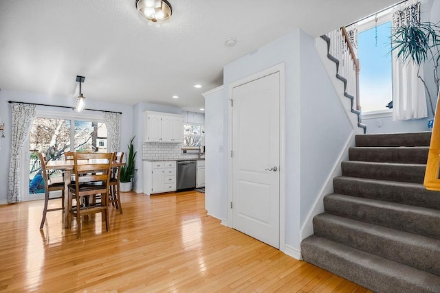 dining space with light hardwood / wood-style flooring