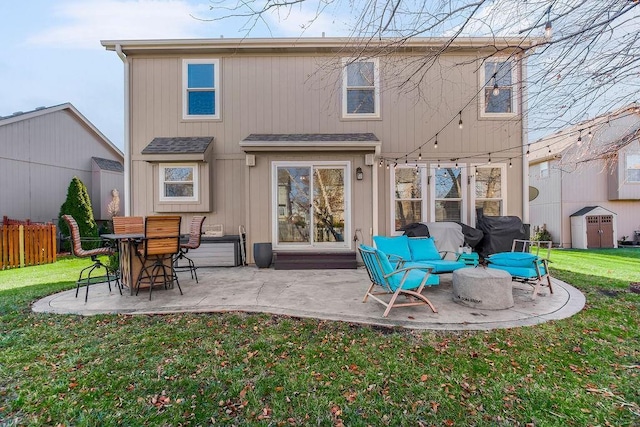 back of house featuring a lawn, an outdoor hangout area, and a patio