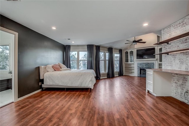 unfurnished bedroom with ceiling fan, dark hardwood / wood-style flooring, and vaulted ceiling