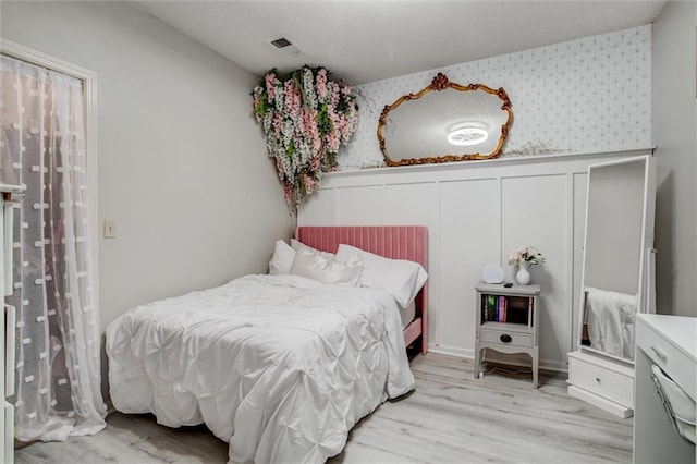 bedroom featuring light wood-type flooring