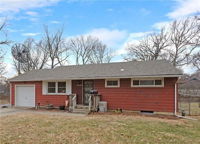 view of front of home featuring a front yard and a garage