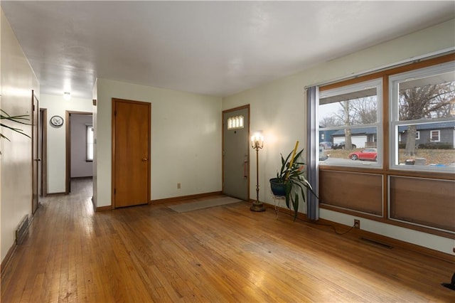 spare room with light hardwood / wood-style floors