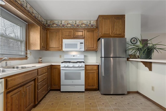 kitchen with sink and white appliances