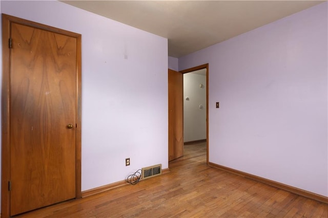 interior space featuring light wood-type flooring and a closet