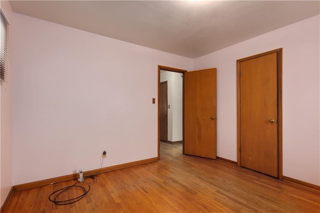 unfurnished bedroom with light hardwood / wood-style flooring