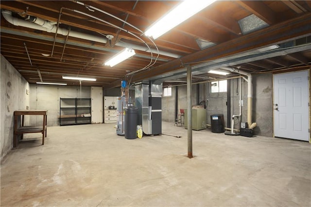 basement featuring heating unit and washer / dryer