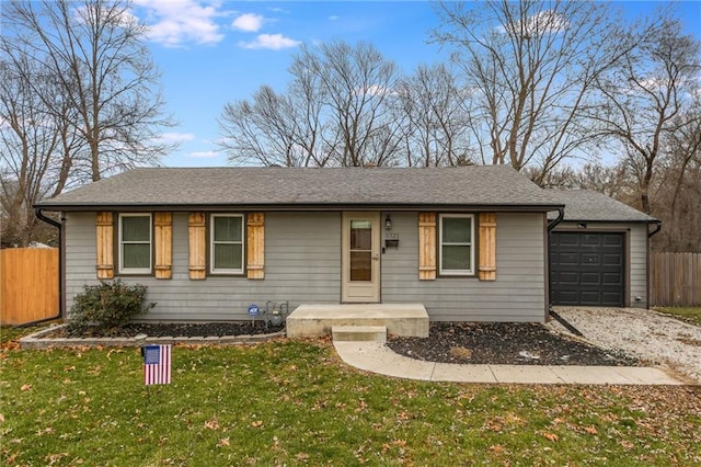 ranch-style house with a front lawn and a garage