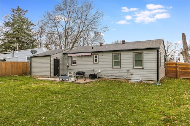 rear view of property with a yard, a patio area, and central air condition unit