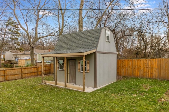 view of outdoor structure featuring a lawn