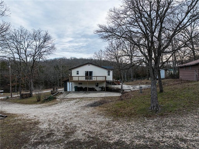 view of front of home with a patio and a wooden deck