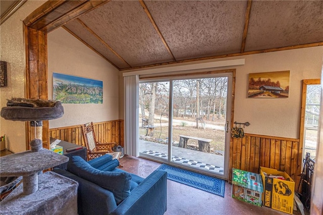 living room featuring lofted ceiling