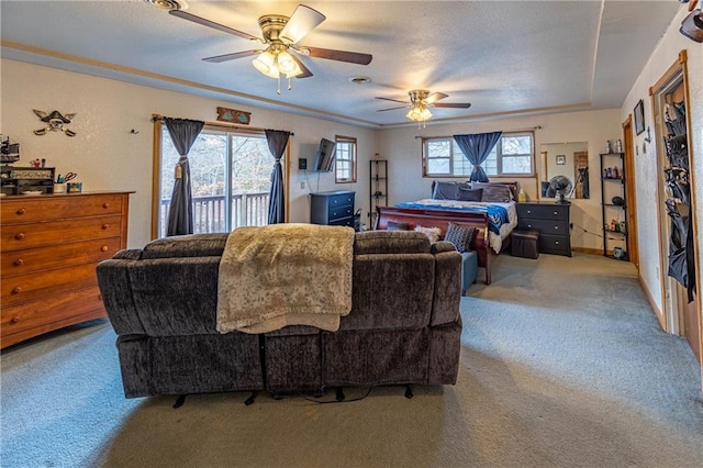 living room with light carpet, plenty of natural light, and ceiling fan