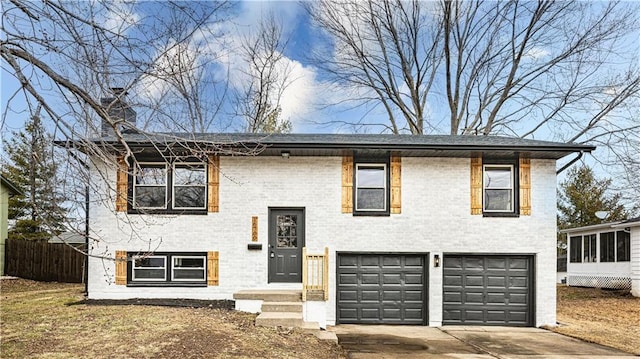 raised ranch featuring a garage