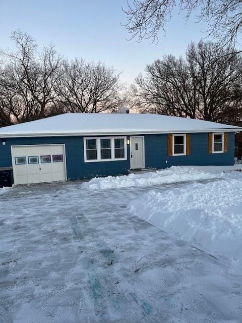 ranch-style house featuring a garage