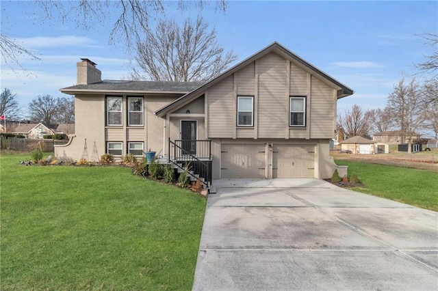 view of front of property featuring a garage and a front yard