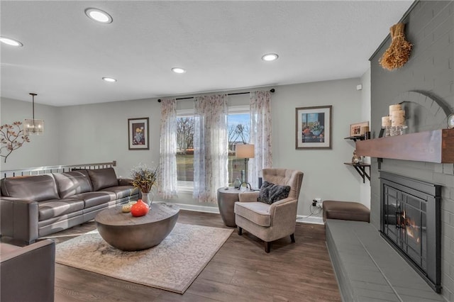 living room featuring dark wood-type flooring and a chandelier