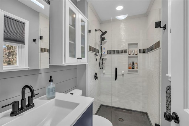 bathroom with toilet, a shower with shower door, ornamental molding, vanity, and backsplash