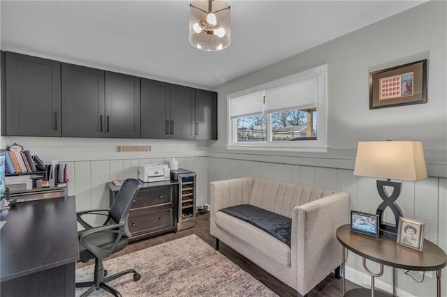 home office featuring dark hardwood / wood-style floors and beverage cooler