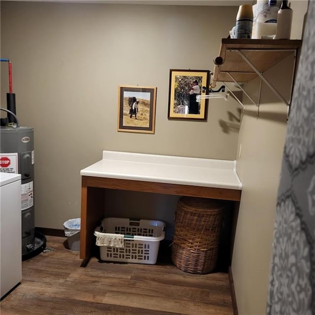 laundry room featuring washer / dryer, electric water heater, and wood-type flooring