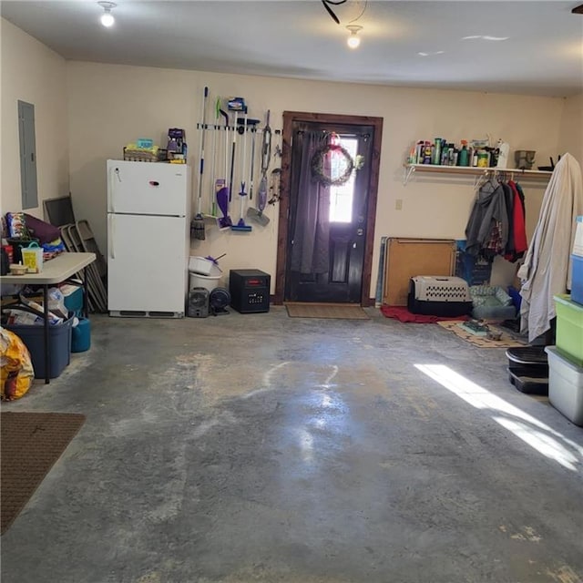 foyer entrance featuring concrete flooring and electric panel