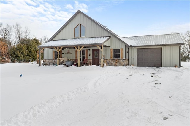 modern farmhouse style home with covered porch and a garage