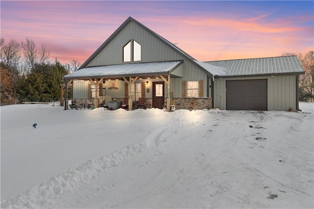 modern inspired farmhouse with a garage