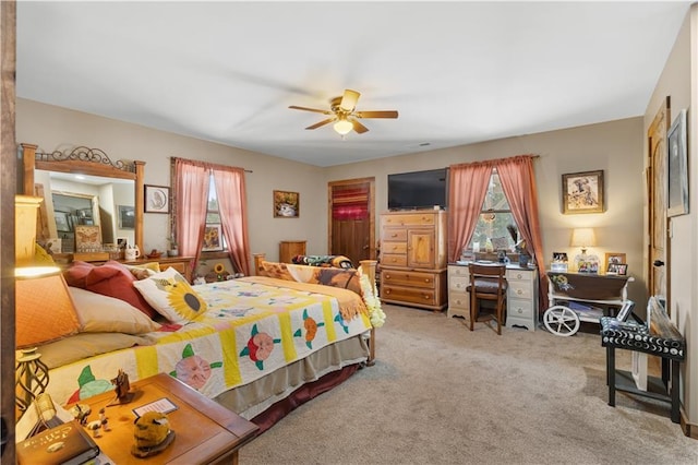 bedroom featuring ceiling fan and light carpet