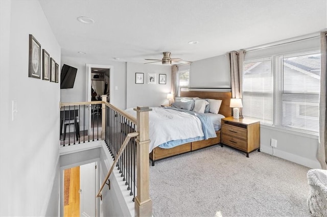 carpeted bedroom featuring ceiling fan