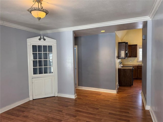 unfurnished dining area featuring dark hardwood / wood-style floors and ornamental molding