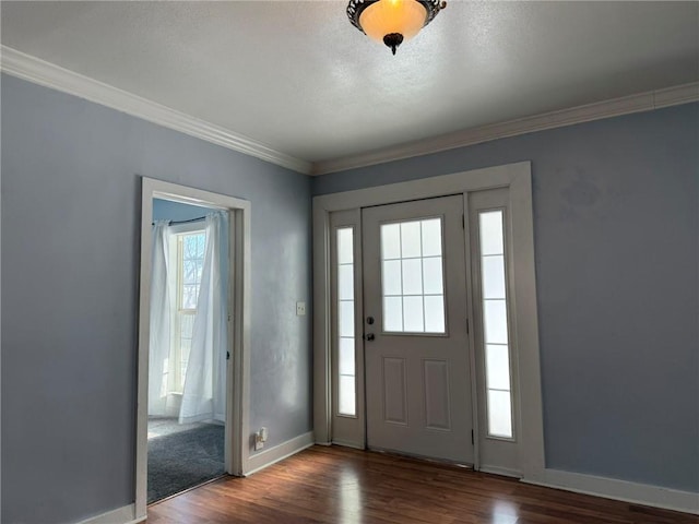 entryway featuring dark hardwood / wood-style flooring and ornamental molding